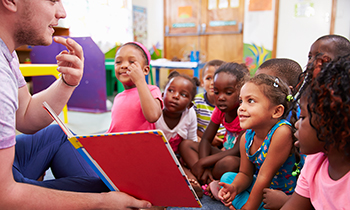 teacher reading to young children