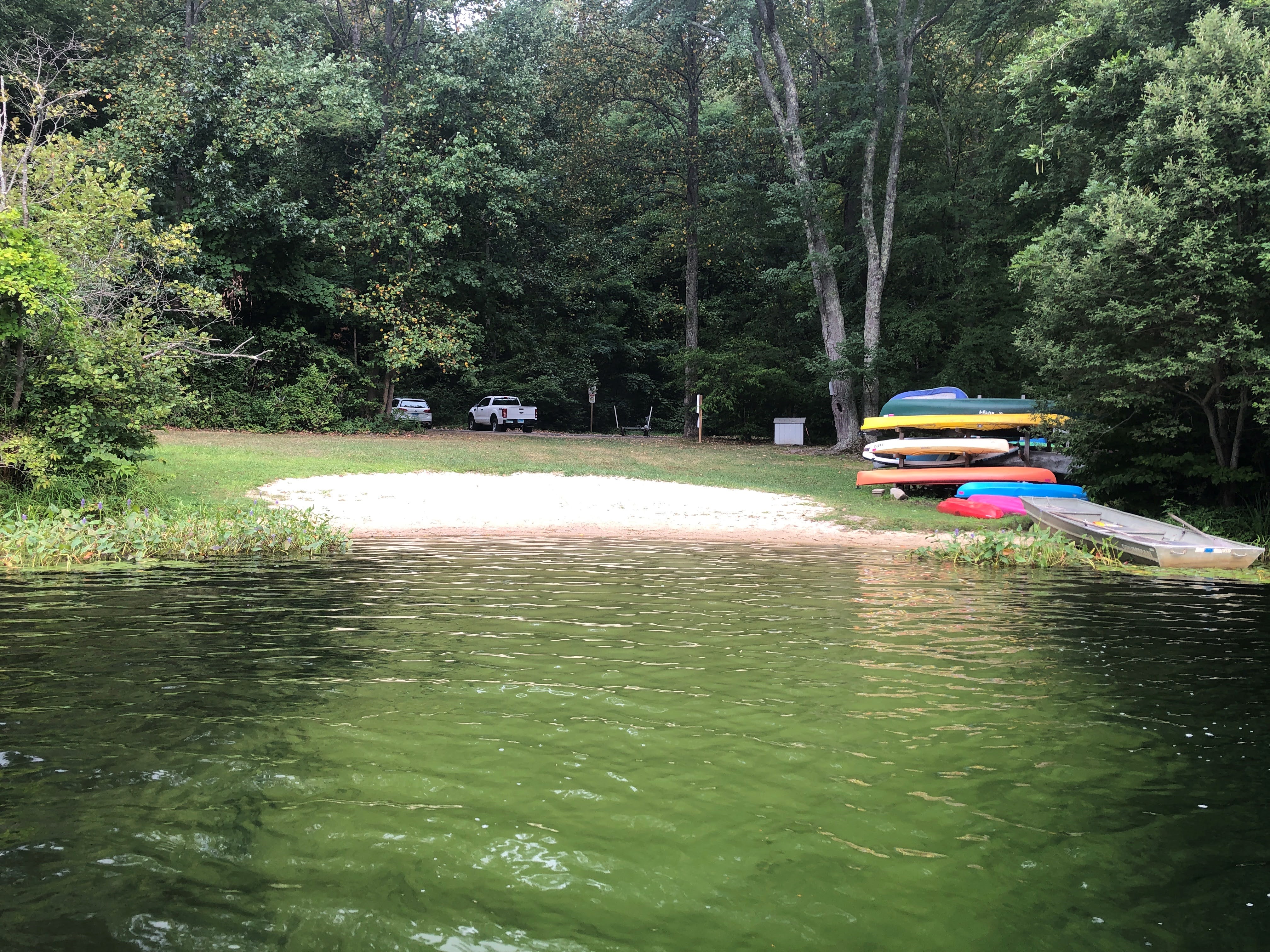 Landscape photo of a beach at Green Pond in Sherman, CT.