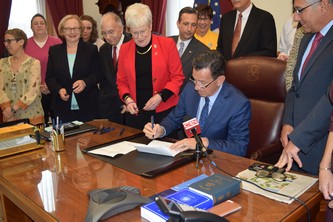 Bill signing ceremony for anti-conversion therapy bill attended by Governor Malloy, Lt. Governor Wyman and bill proponents