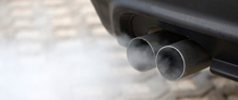Car tailpipe with smoke