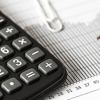 Calculator sitting on paperwork