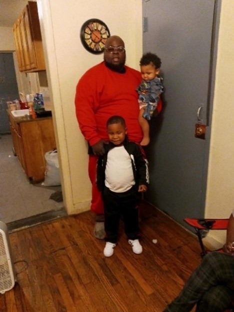 Photo of Jeffrey with his two children