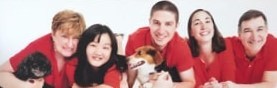 Photo of the family, all in red