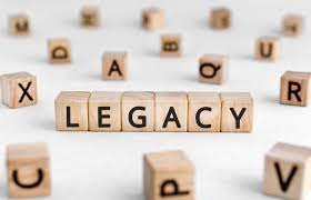 Letter blocks are scattered on a white background; in the middle, the blocks spell out "legacy"