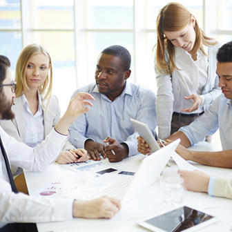 People Sitting Around a Desk 