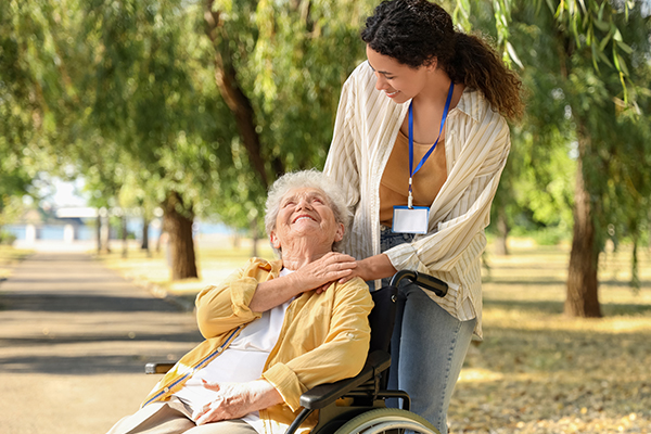 Young mother and son picking out produce in a grocery store.