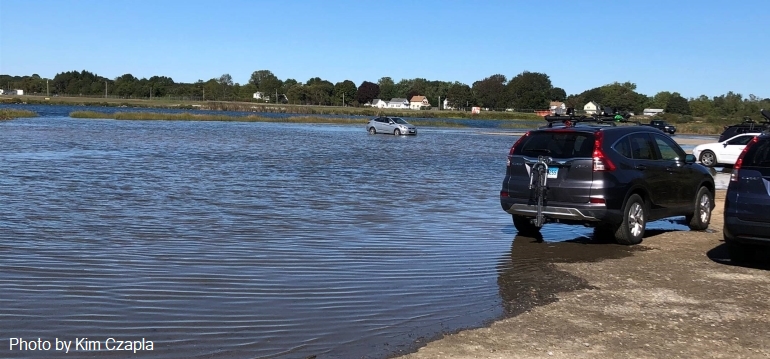 flooding approaching cars in parking lot