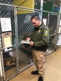 CT State Animal Control Officer inspecting kennel