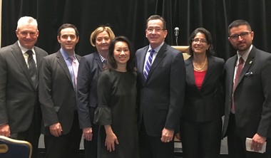 Governor Malloy stands with representatives of organizations helping to fight human trafficking