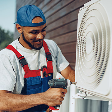 Man installing AC unit
