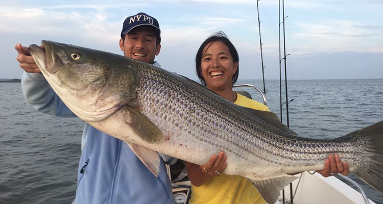 Saltwater anglers displaying their catch.