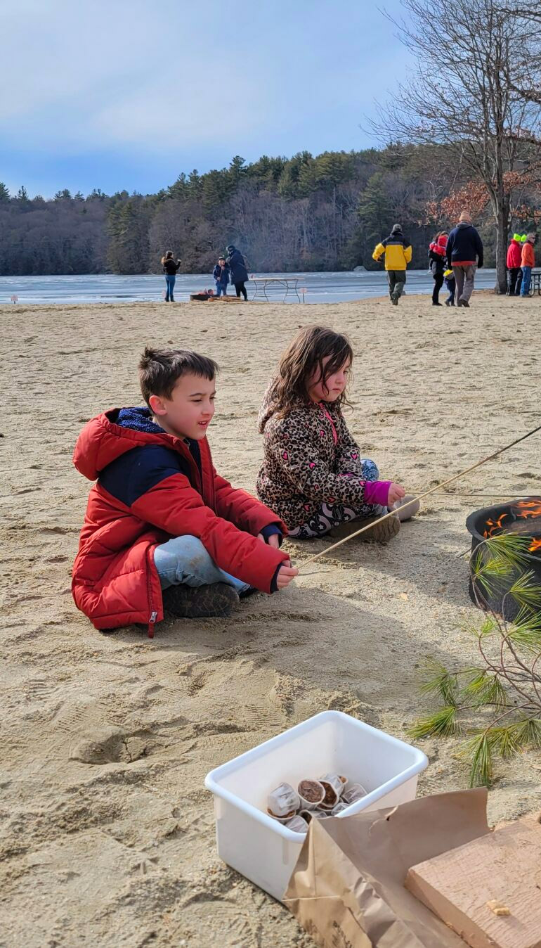 brother and sister eating smores