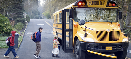 Children and a school bus