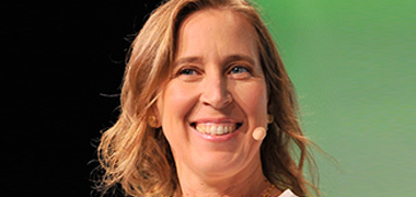 photo of Susan Wojcicki speaking into a headset