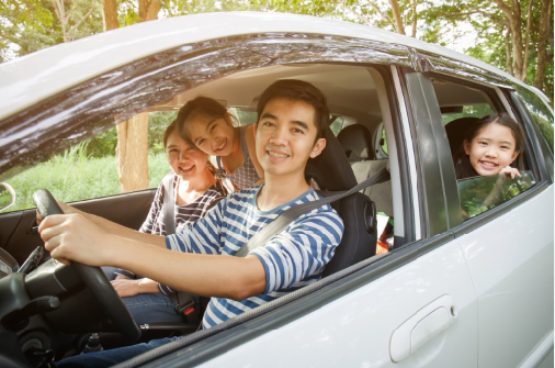 family driving new electric vehicle